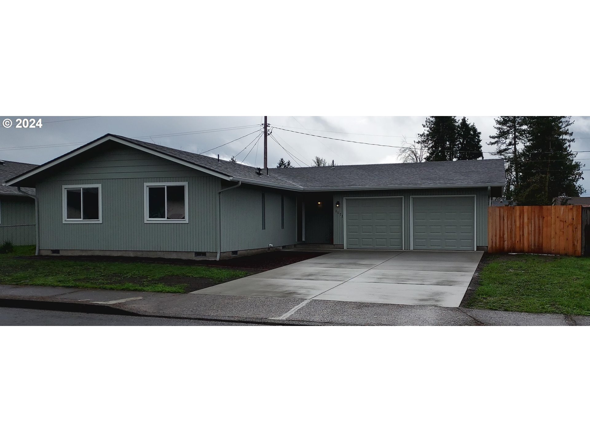 2573 L Street Springfield, OR 97477 - Photo 1 of 22 a black and white photo of a house