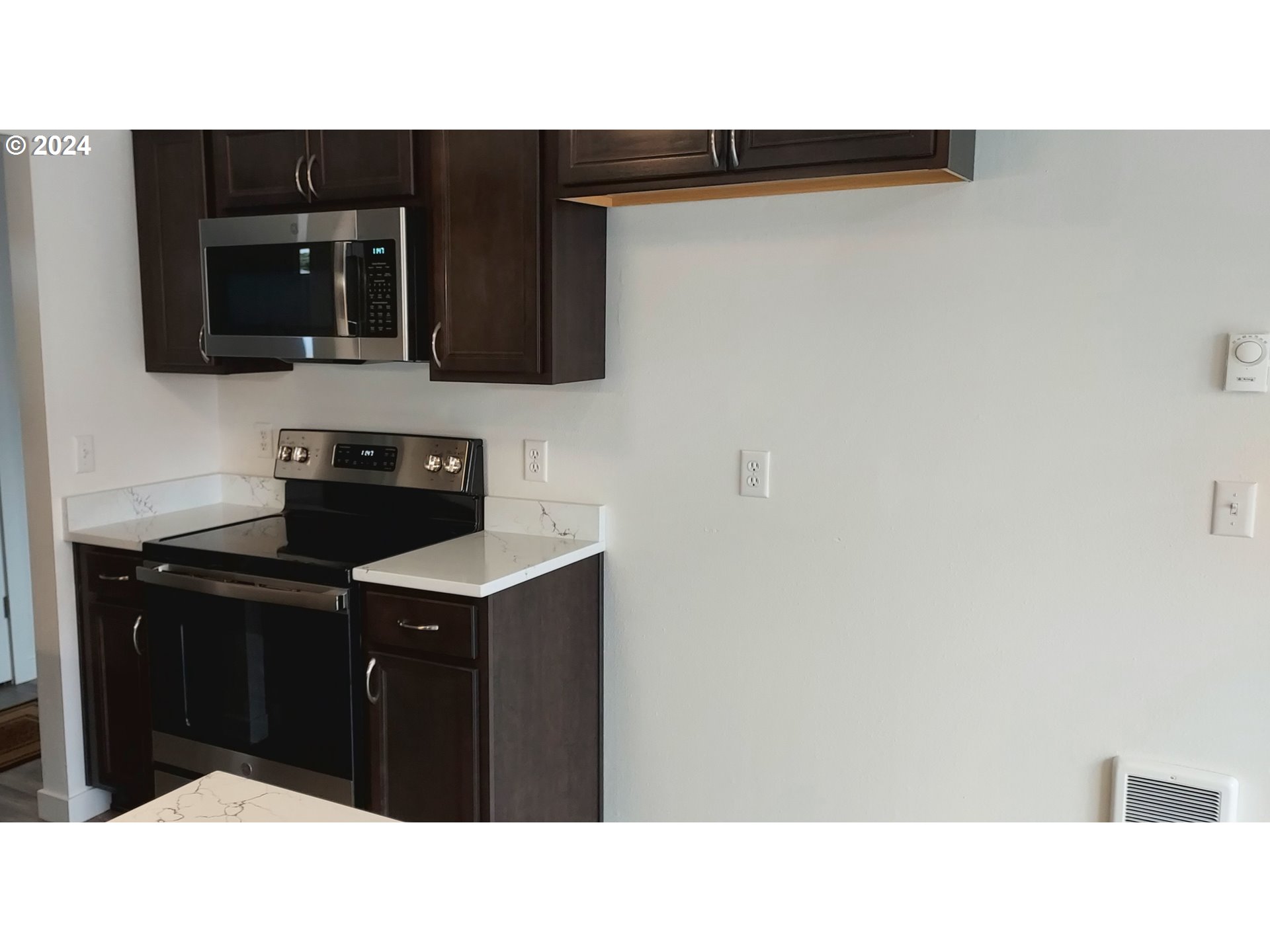2573 L Street Springfield, OR 97477 - Photo 13 of 22 a kitchen with a sink and cabinets