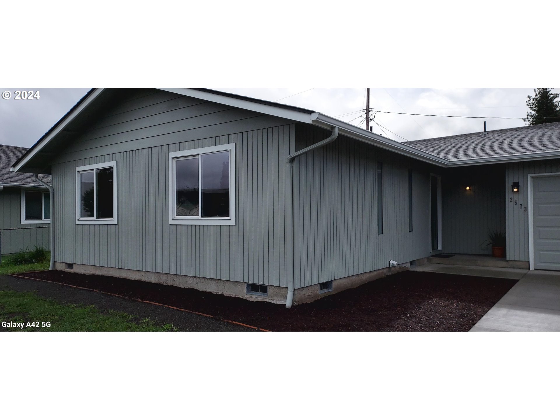 2573 L Street Springfield, OR 97477 - Photo 4 of 22 a black white house with outdoor space