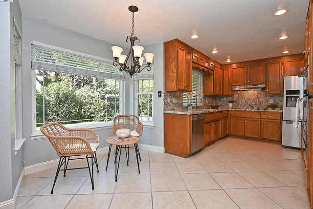 a dining room filled with furniture and window