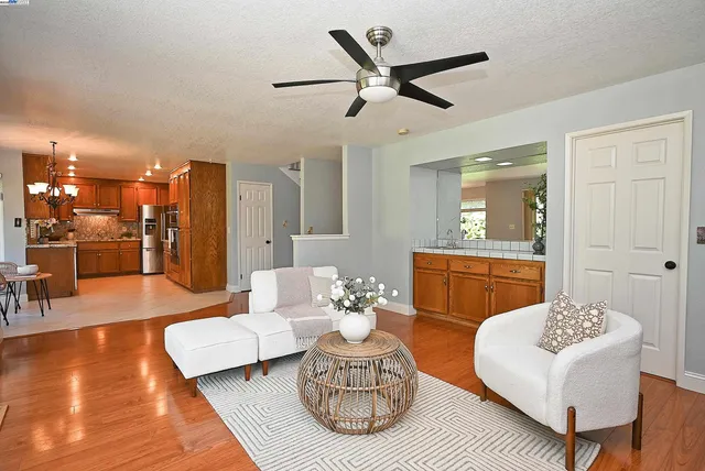 a living room with furniture fireplace and window
