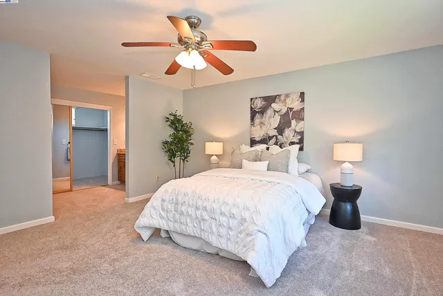 a bedroom with bed and window