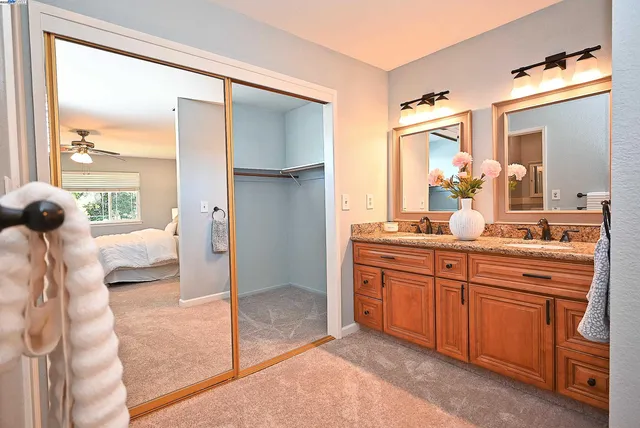 a bathroom with a shower a toilet and a window