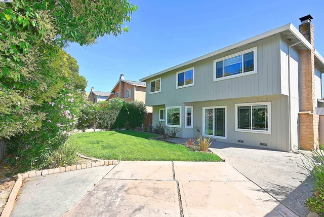 a view of a backyard with a small cabin