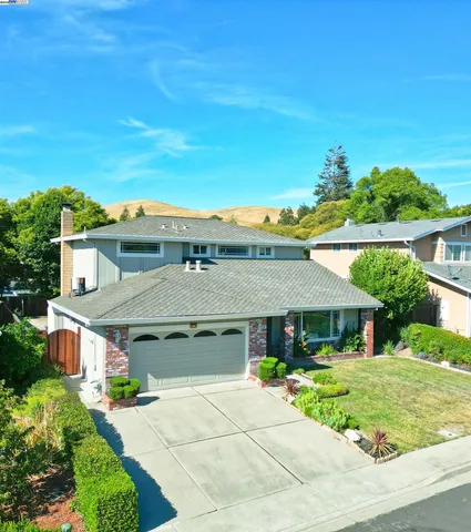 an aerial view of a house with a garden
