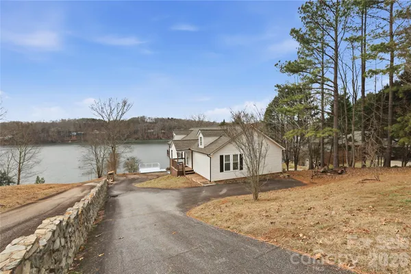 a view of a lake with a house in the background