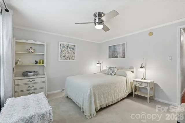 a bedroom with a bed and a cabinets