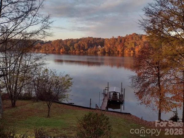 a view of a patio with table and chairs the couches and potted plants