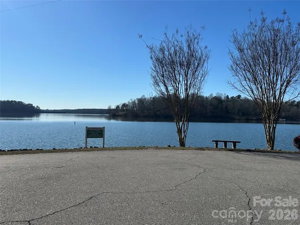 a view of a swimming pool with a yard