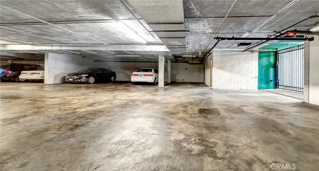 a view of parking garage with cars