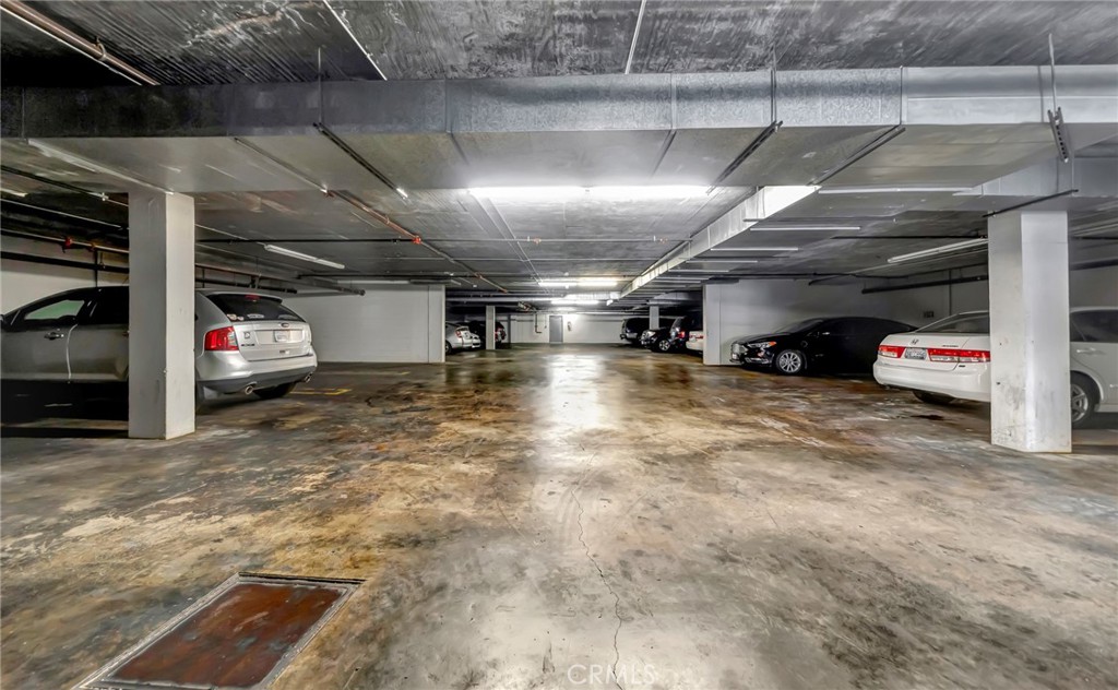 316 South New Hampshire Avenue, Unit 307 Los Angeles, CA 90020 - Photo 17 of 23 a view of parking garage with cars