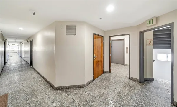 a view of hallway with livingroom