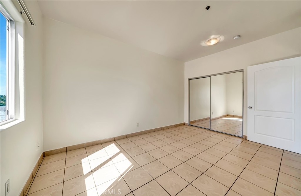 316 South New Hampshire Avenue, Unit 307 Los Angeles, CA 90020 - Photo 7 of 23 a view of an empty room and window