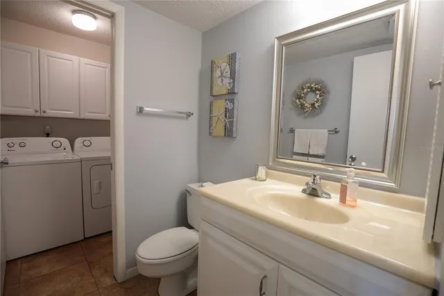 a bathroom with a sink toilet and vanity
