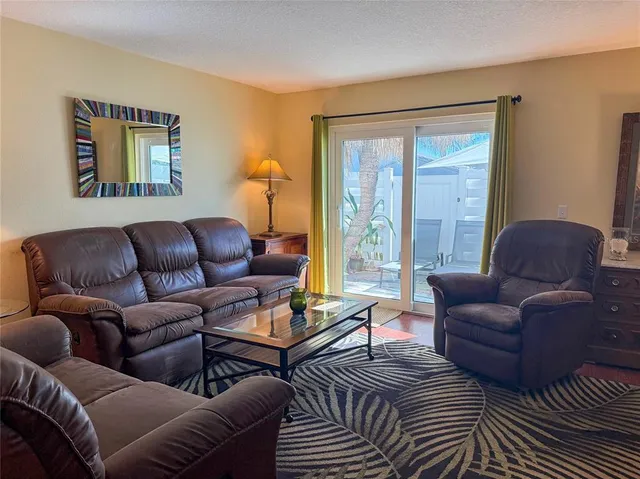 a living room with furniture or couch and a window