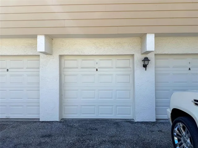 a view of a garage and car parked