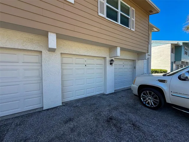 a balcony with table and chairs