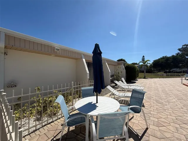 a view of a park with large trees