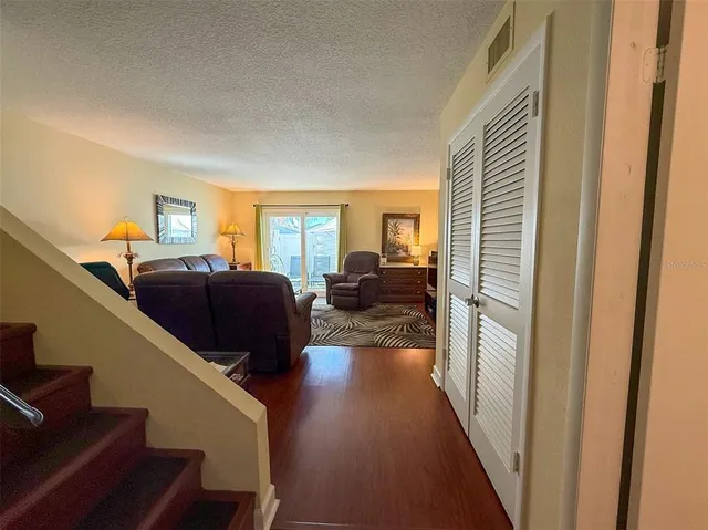 a living room with furniture a couch and a window