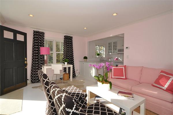 a living room with furniture and flowers