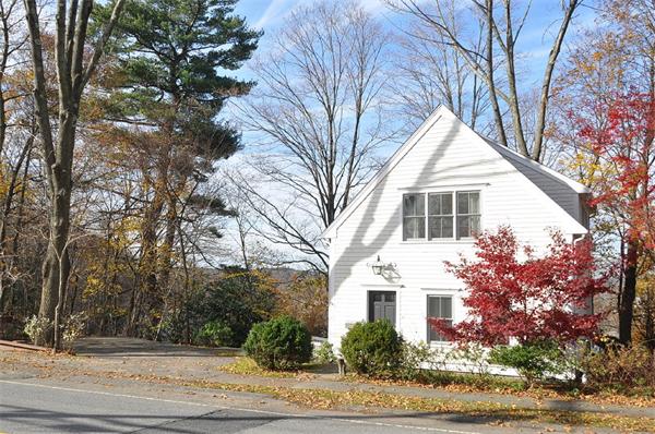 133 Walnut Street Wellesley, MA 02481 - Photo 12 of 12 a front view of a house with yard and trees around