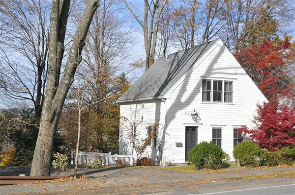 133 Walnut Street Wellesley, MA 02481 - Photo 10 of 12 a view of a white house with a yard and potted plants