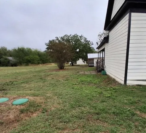 a view of a backyard with a garden