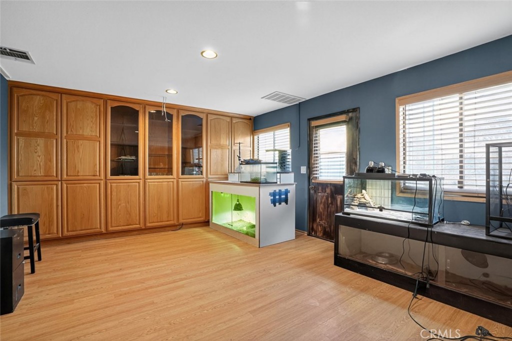 31653 Lake Meadow Road Acton, CA 93510 - Photo 13 of 32 a kitchen with stainless steel appliances granite countertop a refrigerator a sink and wooden floors