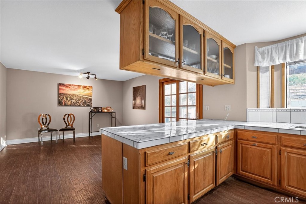31653 Lake Meadow Road Acton, CA 93510 - Photo 17 of 32 a kitchen with cabinets and wooden floor