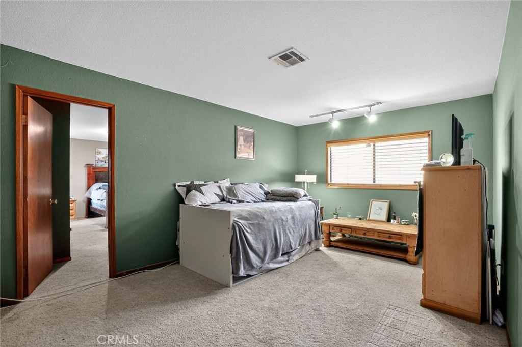 31653 Lake Meadow Road Acton, CA 93510 - Photo 24 of 32 a bedroom with furniture and a window