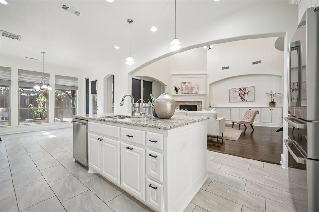 2029 Temperate Drive Allen, TX 75013 - Photo 10 of 40 a kitchen with stainless steel appliances granite countertop a refrigerator a sink and a stove