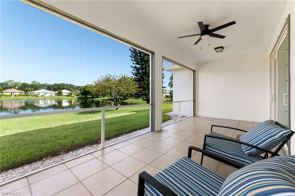 223 Stanhope Circle Naples, FL 34104 - Photo 27 of 41 Screened lanai featuring large format tile flooring and a ceiling fan