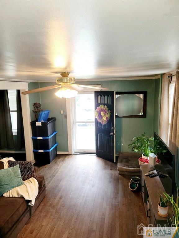 19 Maple Street Parlin, NJ 08859 - Photo 3 of 25 a living room with furniture and a flat screen tv