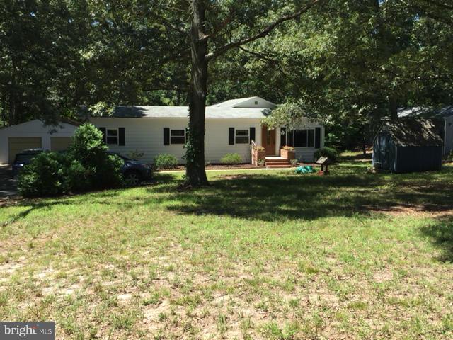 6805 Mackall Road St. Leonard, MD 20685 - Photo 1 of 30 a front view of house with yard and green space