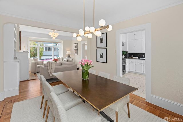 a bathroom with a white bath tub a toilet and a sink