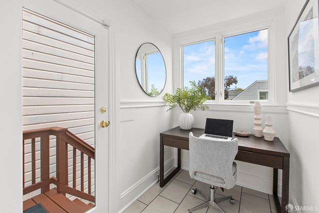 a bathroom with a sink toilet and a mirror