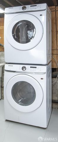 a spacious bedroom with a bed and a window