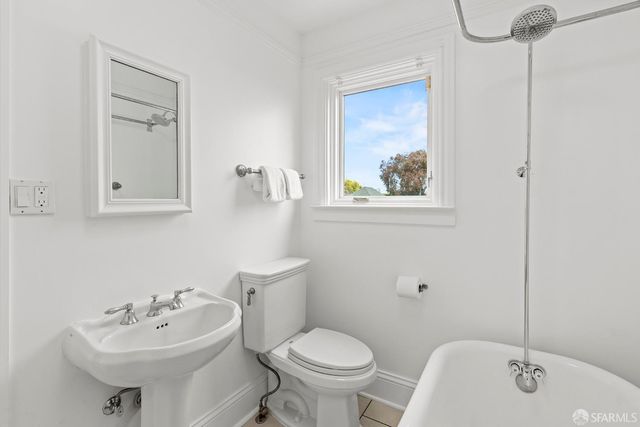 a bathroom with a shower and a bath tub