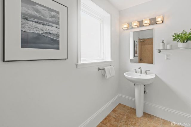 a work room with furniture and a mirror