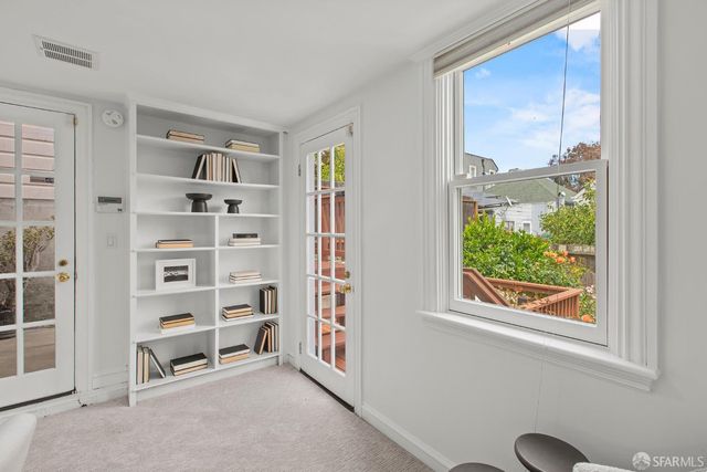 a view of a tree with a backyard