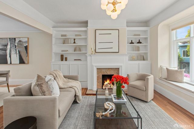 a kitchen with white cabinets and appliances