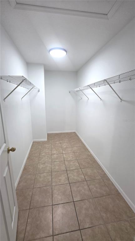 14875 Skip Jack Loop Lakewood Ranch, FL 34202 - Photo 8 of 18 a view of a room with an empty space and a ceiling fan parking space