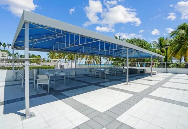 a view of a backyard with sitting area