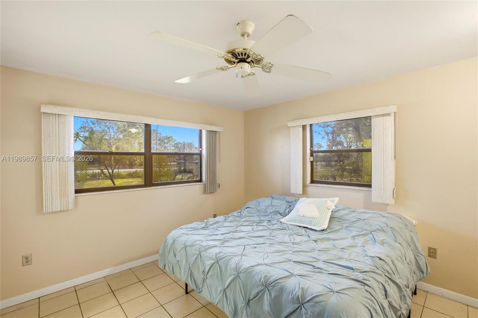49 Williams Road Lake Placid, FL 33852 - Photo 15 of 61 a bedroom with a bed and a window