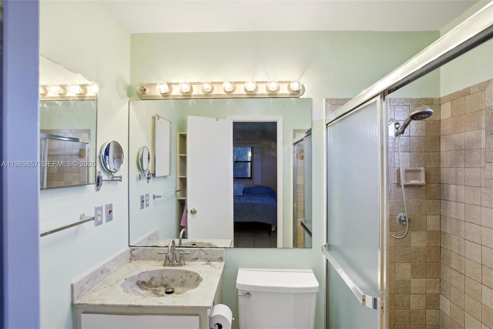 49 Williams Road Lake Placid, FL 33852 - Photo 18 of 61 a bathroom with a sink double vanity and shower