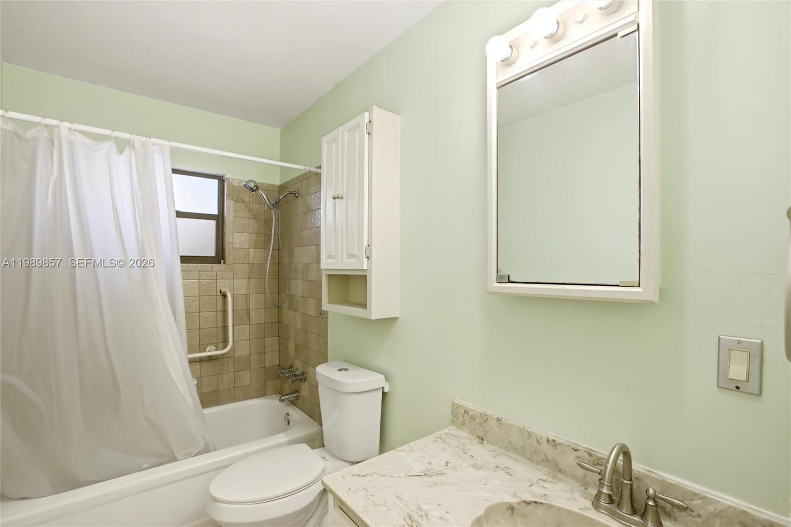 49 Williams Road Lake Placid, FL 33852 - Photo 23 of 61 a bathroom with a sink toilet and shower