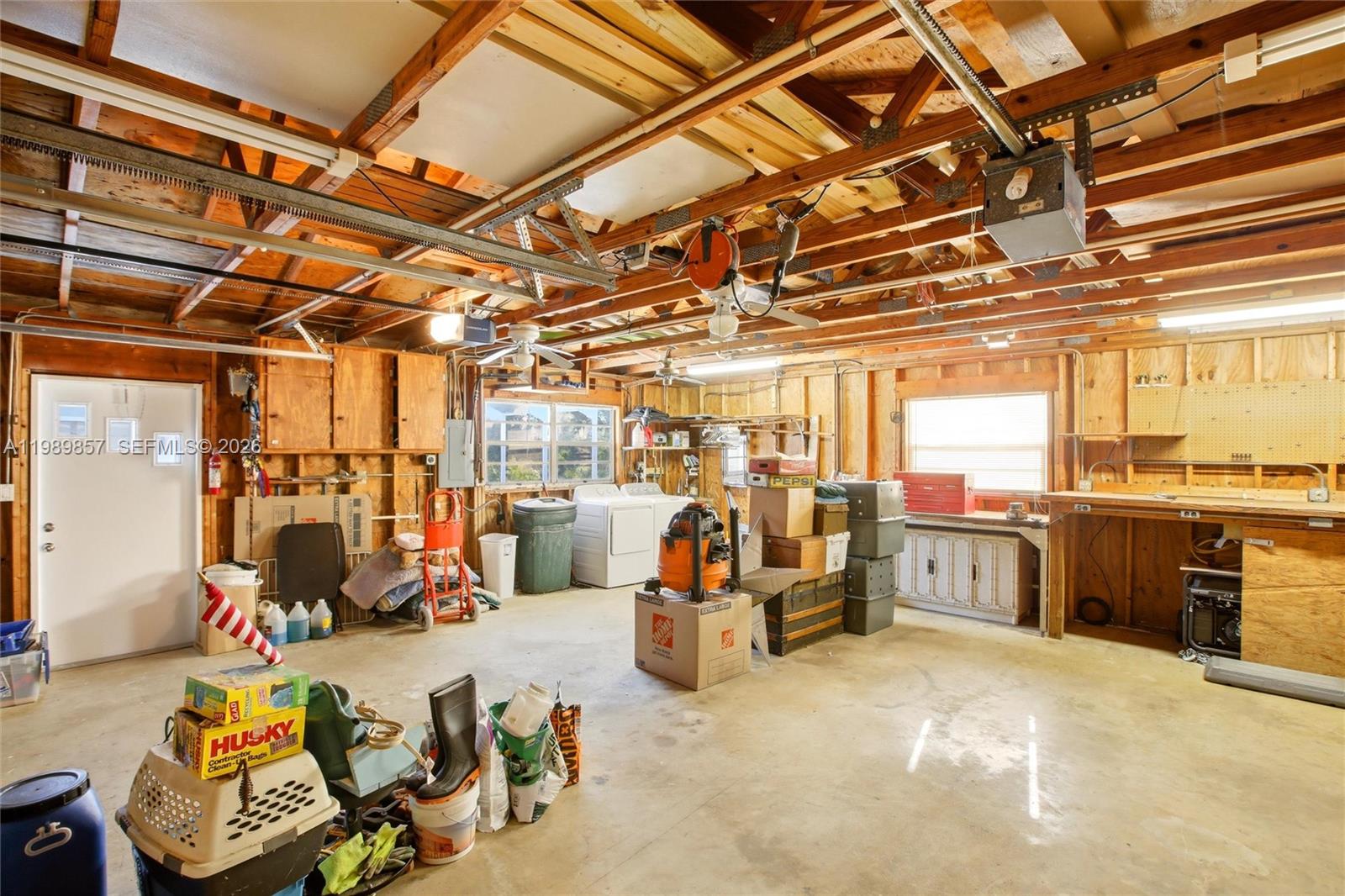 49 Williams Road Lake Placid, FL 33852 - Photo 29 of 61 a view of a storage room with water heater and racks