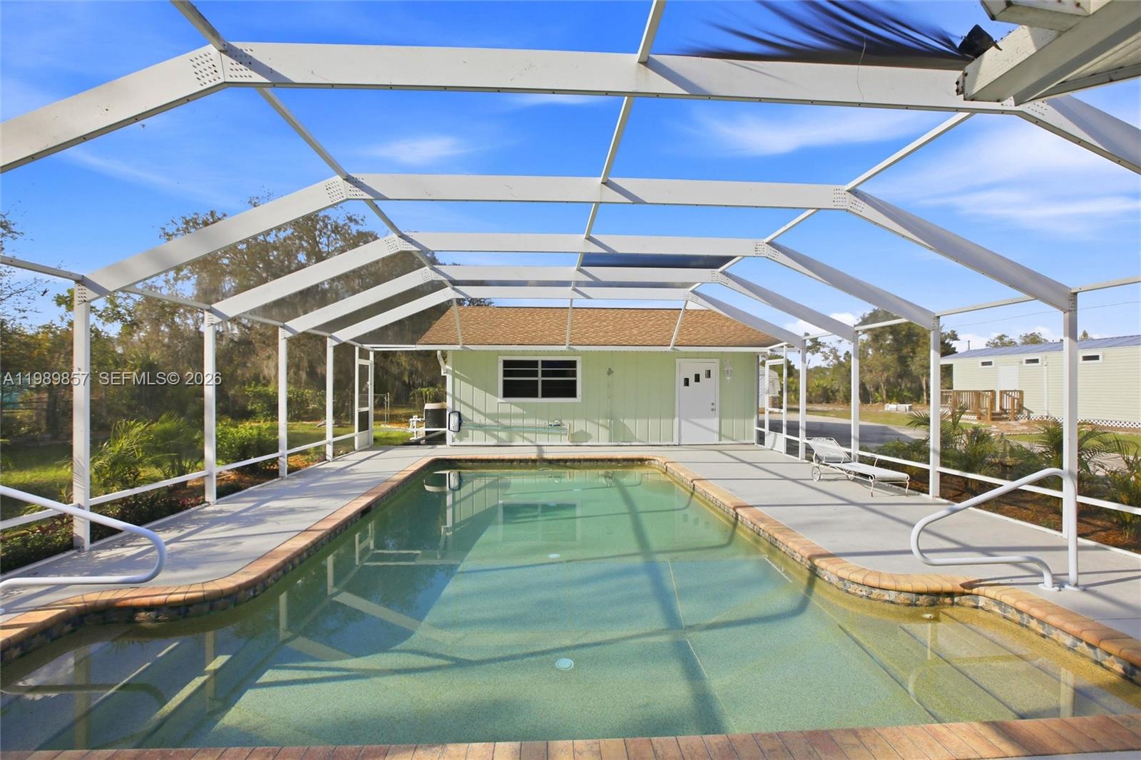 49 Williams Road Lake Placid, FL 33852 - Photo 38 of 61 a view of a backyard with a swimming pool