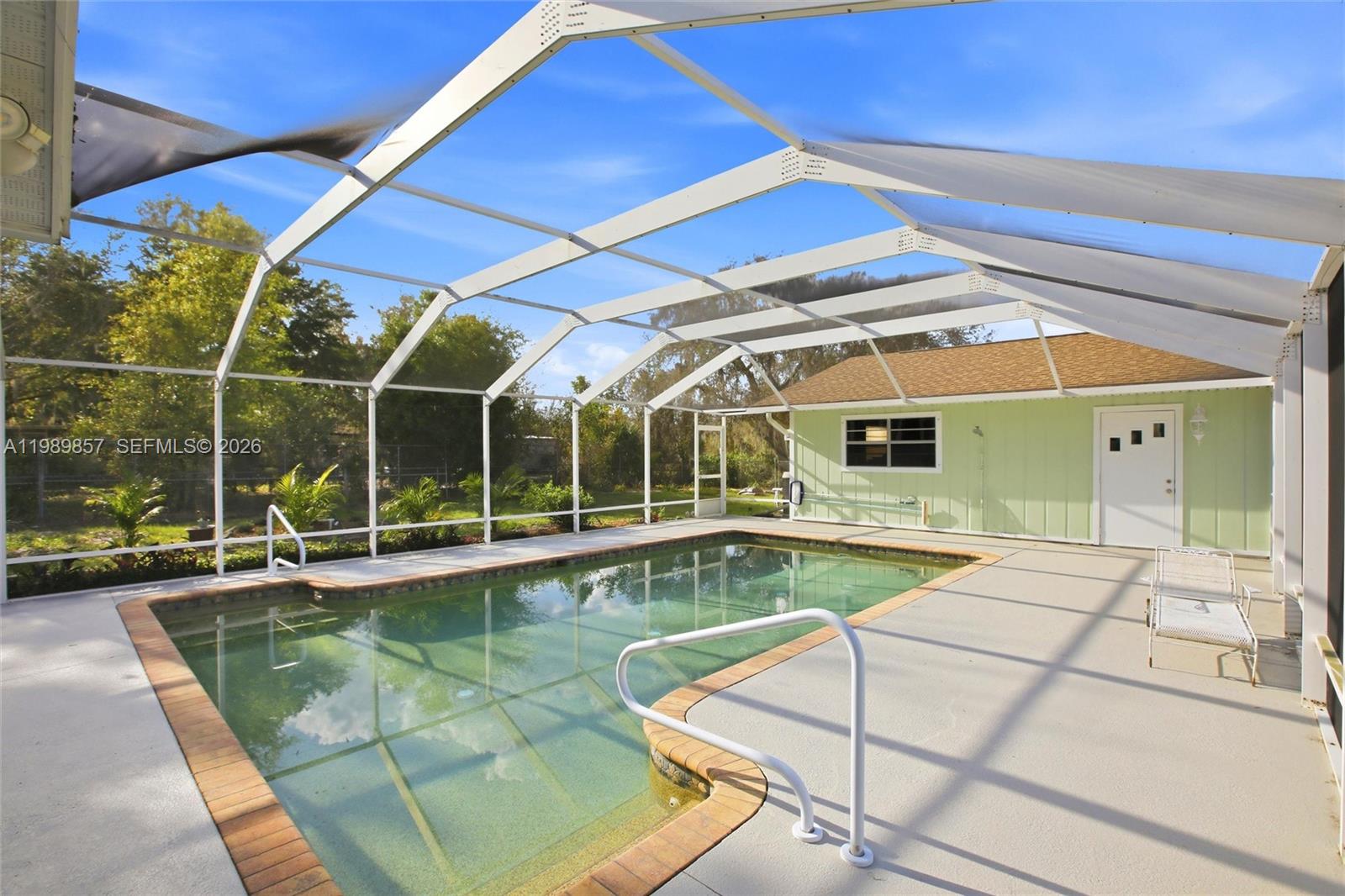 49 Williams Road Lake Placid, FL 33852 - Photo 39 of 61 a view of a swimming pool with a patio