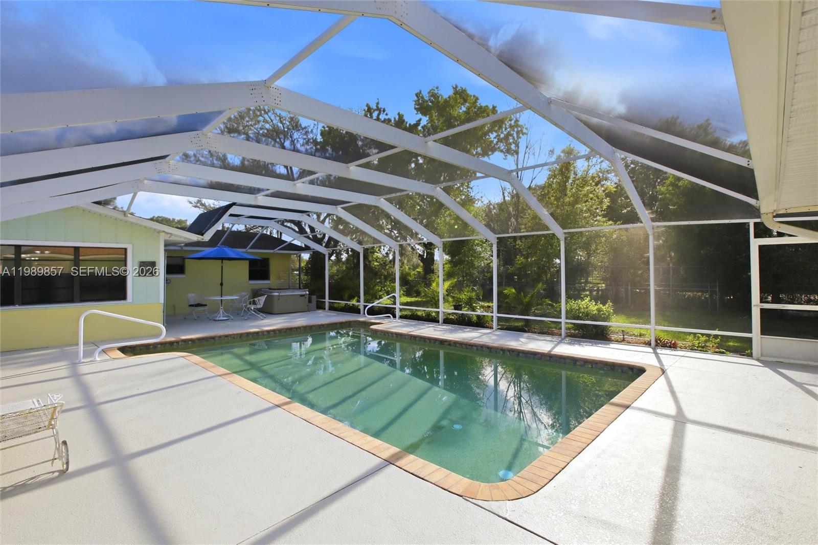 49 Williams Road Lake Placid, FL 33852 - Photo 40 of 61 a view of a swimming pool with a patio